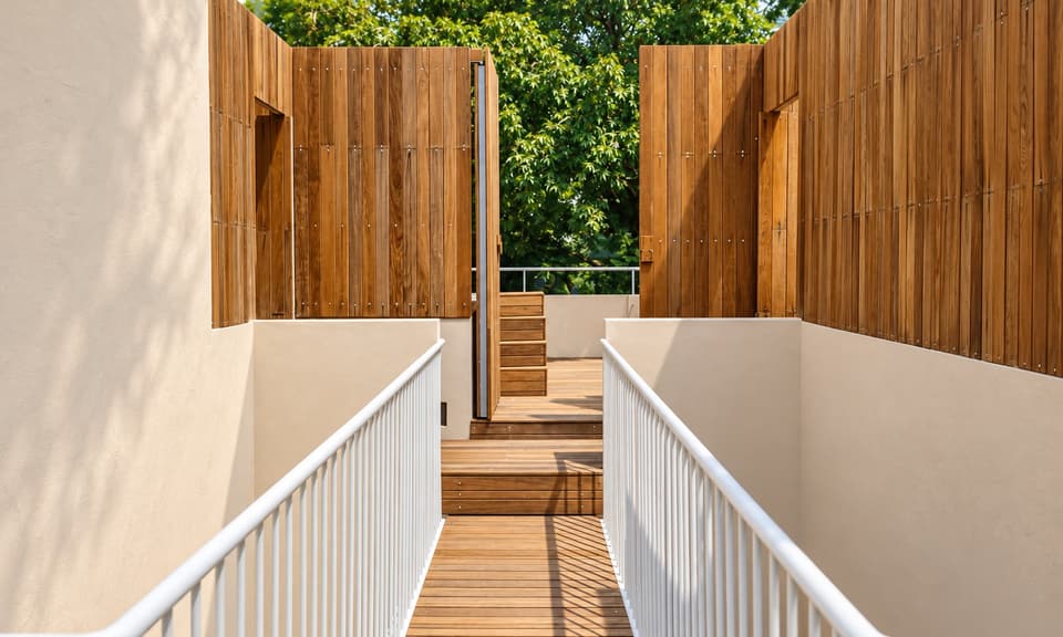 The stair up to the roof between timber walls